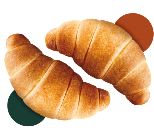 Due croissant appena sfornati su uno sfondo colorato e accogliente per la colazione